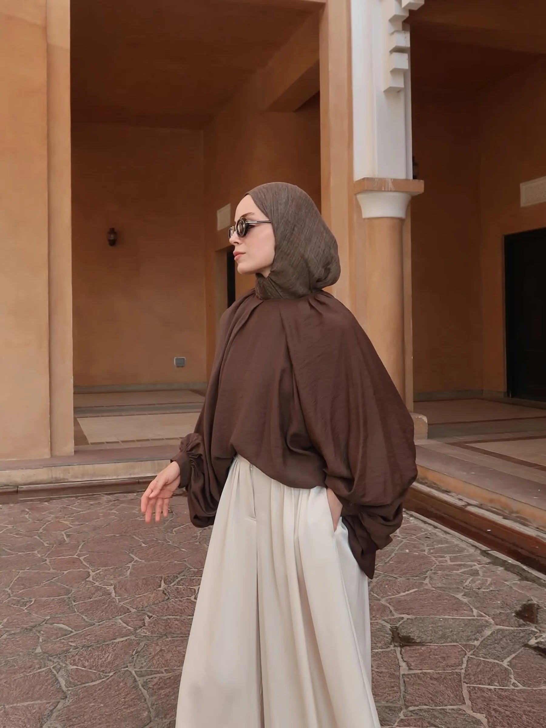 Samra Wide-Leg Trousers in Cream by Muserobe, fabric and fit detail